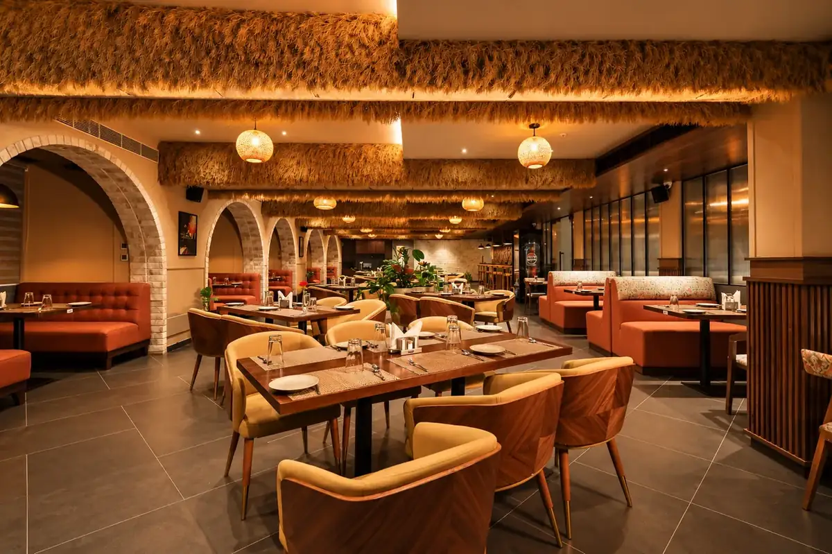 Cozy brick archway alcoves and plush booth seating at Brick and Brew restaurant